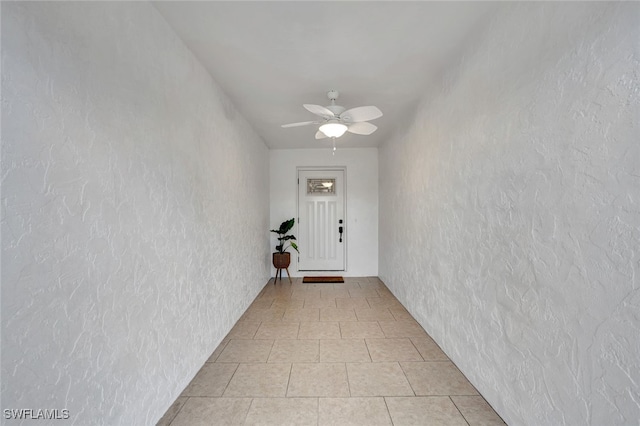 entrance to property featuring ceiling fan