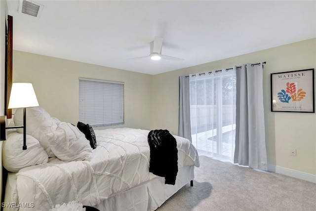 carpeted bedroom with ceiling fan and access to exterior