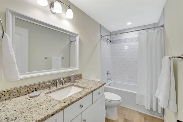 full bathroom with toilet, vanity, shower / bath combo, and hardwood / wood-style flooring