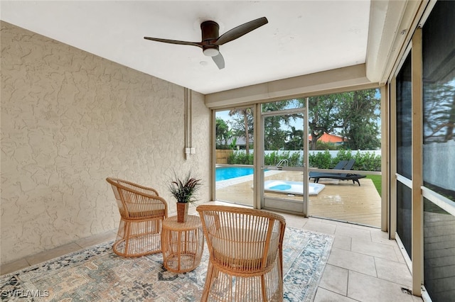 sunroom / solarium with ceiling fan