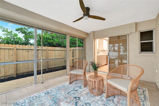 sunroom with plenty of natural light and ceiling fan