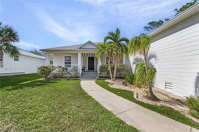 view of front facade featuring covered porch and a front yard