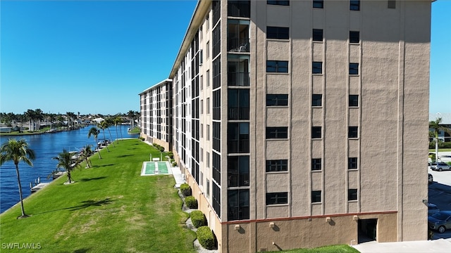 view of building exterior with a water view