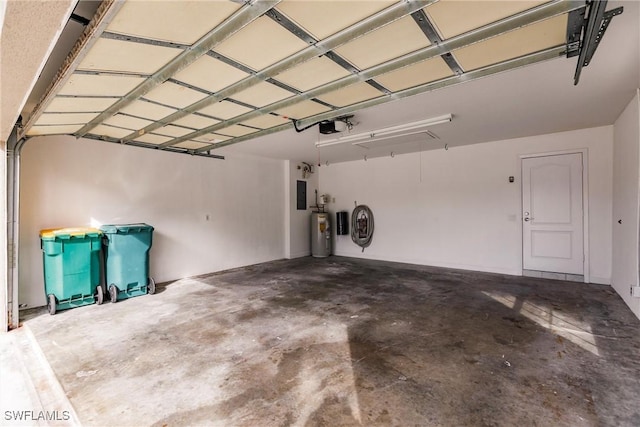 garage with a garage door opener, electric panel, and water heater