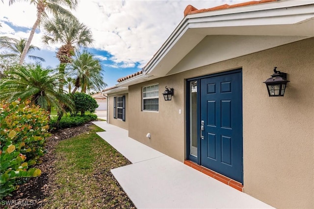 4747 San Carlo Ct, Naples, FL 34109 - property entrance featuring stucco siding