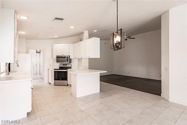 kitchen with appliances with stainless steel finishes, sink, white cabinets, light tile patterned floors, and ceiling fan