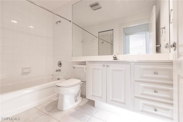 full bathroom with tiled shower / bath combo, vanity, tile patterned flooring, and toilet