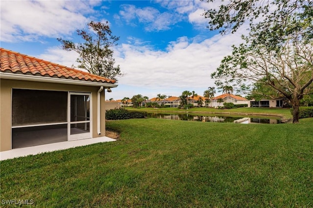 view of yard with a water view