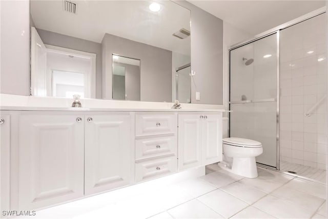 4747 San Carlo Ct, Naples, FL 34109 - bathroom featuring a shower stall, toilet, double vanity, and tile patterned floors