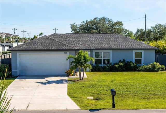 ranch-style home featuring a front lawn and a garage