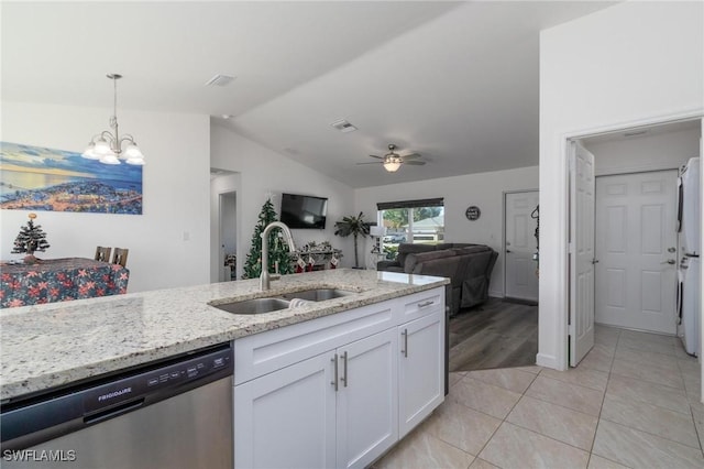 kitchen with white cabinets, ceiling fan with notable chandelier, sink, dishwasher, and lofted ceiling