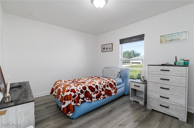 bedroom featuring dark wood-type flooring