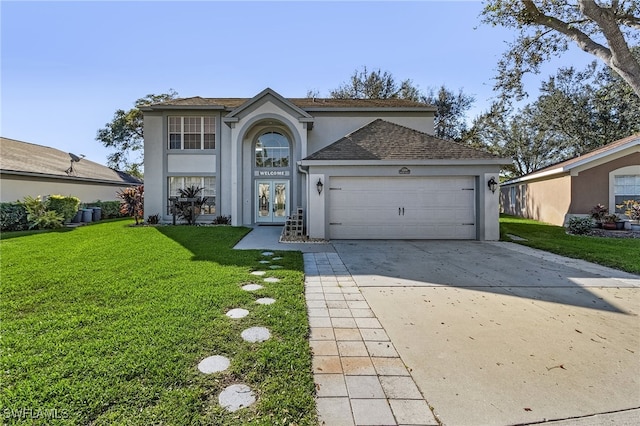 front facade featuring a garage, a front yard, and french doors