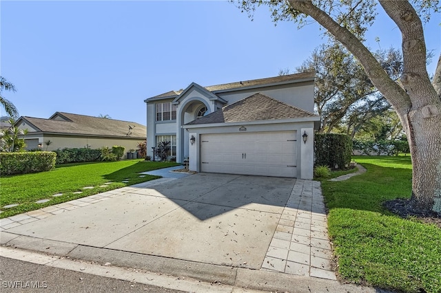 view of front property featuring a front lawn and a garage