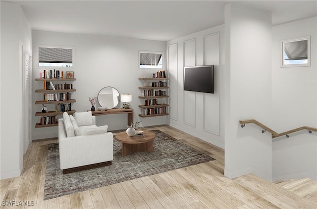 sitting room featuring light hardwood / wood-style flooring