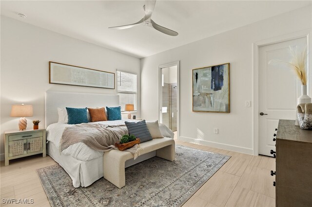 bedroom featuring ensuite bath and ceiling fan