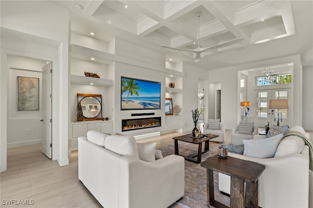 living room with coffered ceiling, ceiling fan, built in features, beamed ceiling, and a high ceiling