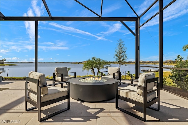 view of patio featuring a fire pit and a water view