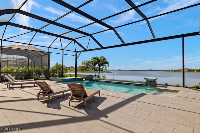 view of swimming pool featuring pool water feature, a lanai, a patio, and a water view