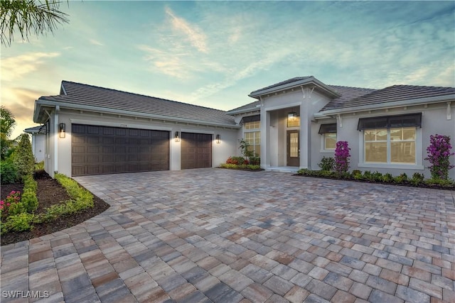 view of front of home with a garage