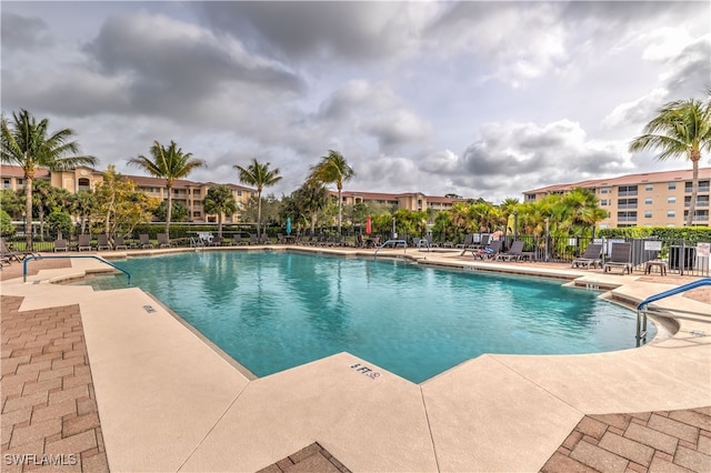 view of swimming pool with a patio