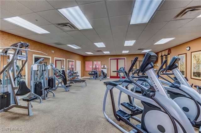 exercise room with a drop ceiling