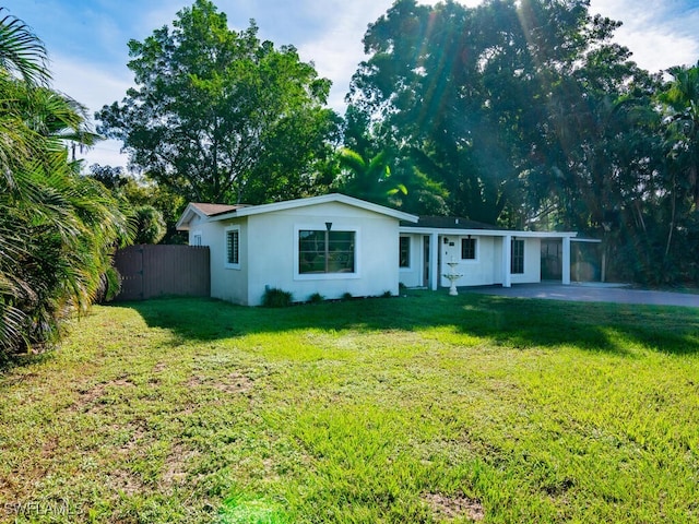 ranch-style house with a front lawn