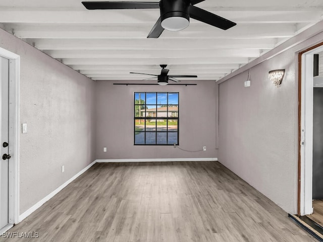 unfurnished room with beam ceiling, ceiling fan, and light hardwood / wood-style flooring