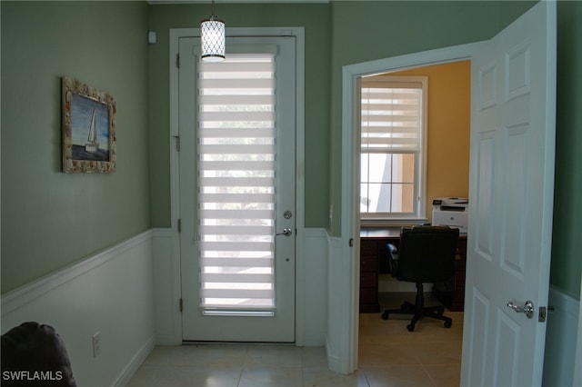 entryway with light tile patterned floors