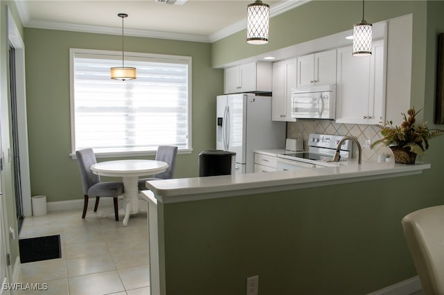 kitchen featuring white appliances, hanging light fixtures, decorative backsplash, white cabinetry, and kitchen peninsula