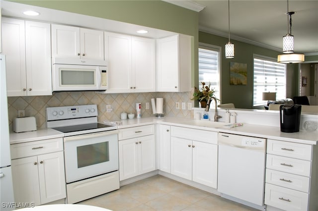 kitchen with pendant lighting, white appliances, sink, light tile patterned flooring, and white cabinetry