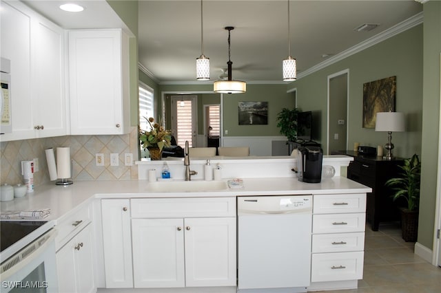 kitchen featuring sink, hanging light fixtures, light tile patterned floors, white appliances, and white cabinets