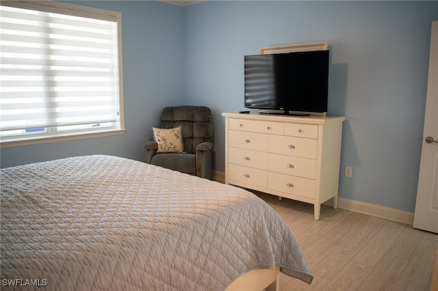 bedroom with light hardwood / wood-style floors