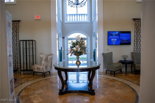 foyer with a towering ceiling