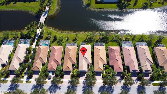 birds eye view of property featuring a water view