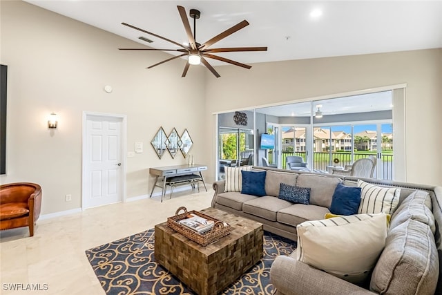 living room featuring ceiling fan and lofted ceiling