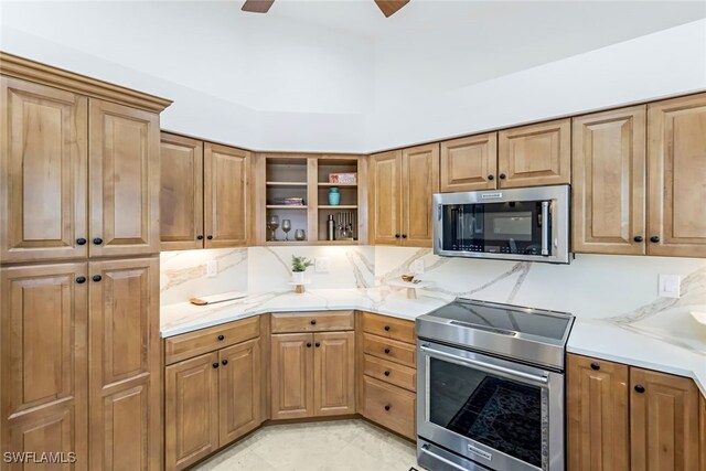 kitchen with ceiling fan and appliances with stainless steel finishes