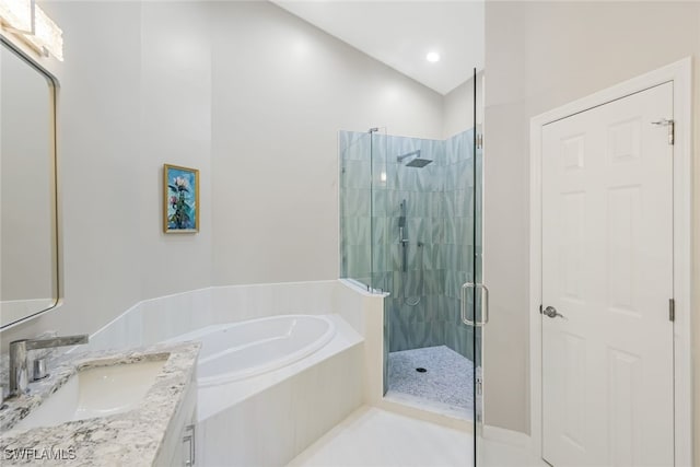 bathroom with plus walk in shower, tile patterned floors, and vanity