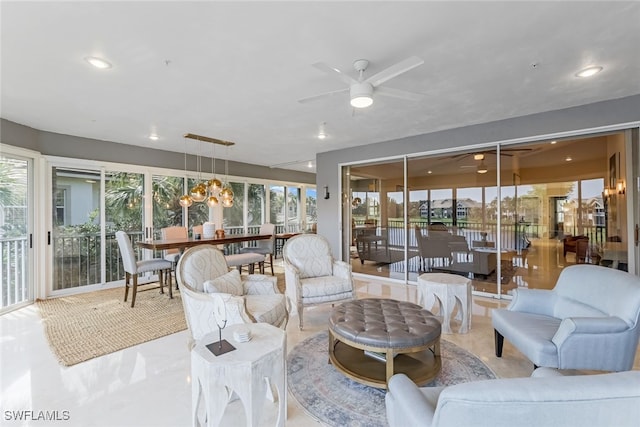 living room with a healthy amount of sunlight and ceiling fan