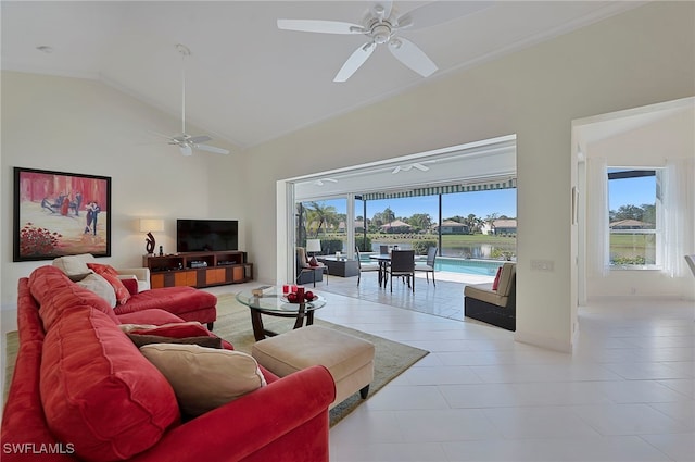 living room featuring high vaulted ceiling, ceiling fan, and light tile patterned flooring