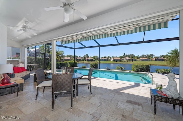 view of swimming pool featuring outdoor lounge area, a patio area, a water view, and glass enclosure