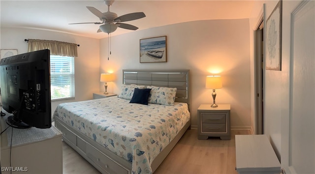 bedroom with ceiling fan and light hardwood / wood-style floors