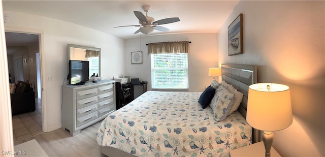 bedroom featuring ceiling fan and light wood-type flooring