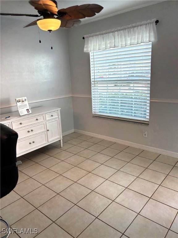 unfurnished bedroom featuring ceiling fan