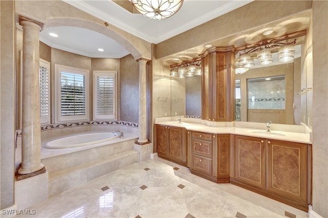 bathroom with a relaxing tiled tub, ornate columns, crown molding, and vanity