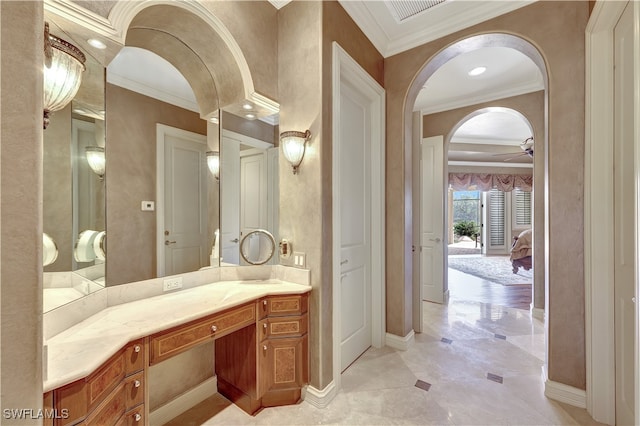 bathroom with vanity, ceiling fan, and crown molding