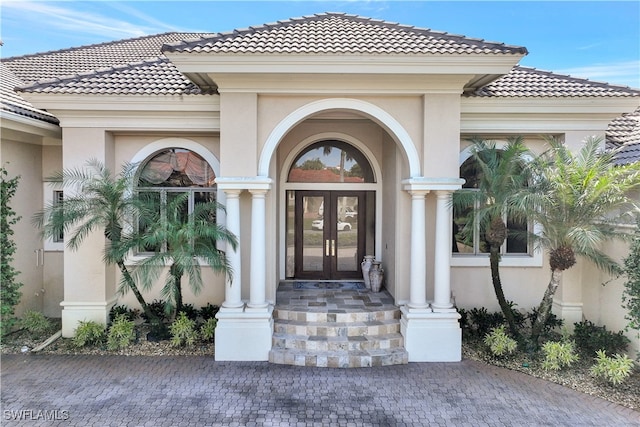 property entrance featuring french doors