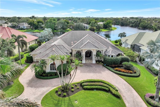 exterior space with a water view and a front yard