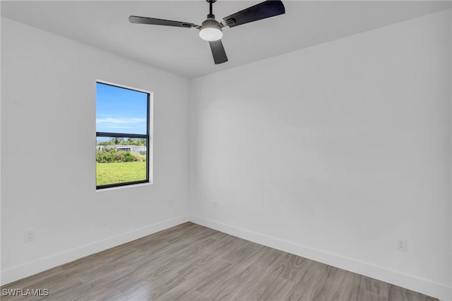 spare room with ceiling fan and light hardwood / wood-style flooring