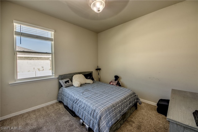 bedroom with ceiling fan and carpet